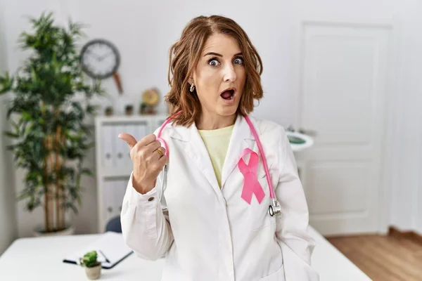 Middle Age Doctor Woman Wearing Pink Cancer Ribbon Uniform Surprised —  Fotos de Stock