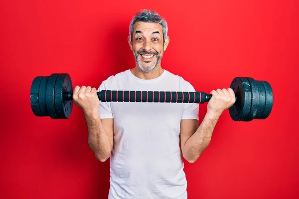 Handsome Middle Age Man Grey Hair Wearing Sportswear Using Dumbbells — Stockfoto