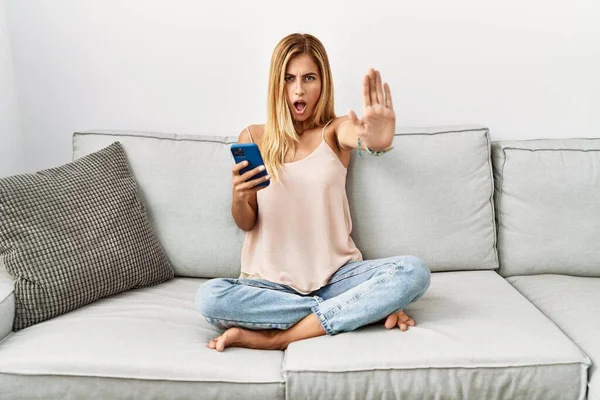 Blonde Beautiful Young Woman Sitting Sofa Home Using Smartphone Doing — Fotografia de Stock