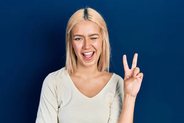 Beautiful Blonde Woman Wearing Casual Sweater Smiling Happy Face Winking — ストック写真