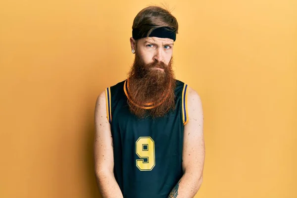 Redhead Man Long Beard Wearing Basketball Uniform Skeptic Nervous Frowning — стоковое фото