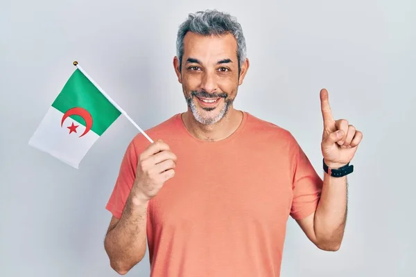 Handsome Middle Age Man Grey Hair Holding Algeria Flag Smiling — 스톡 사진