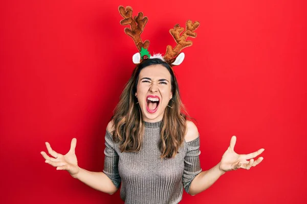 Young Hispanic Girl Wearing Deer Christmas Hat Crazy Mad Shouting — Photo