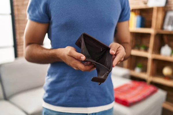 Young Hispanic Man Showing Empty Wallet Sitting Sofa Home — Stock fotografie