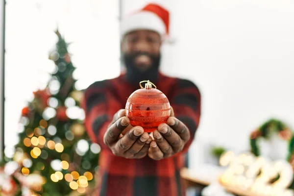 Young African American Man Smiling Confident Holding Ball Standing Christmas — стоковое фото