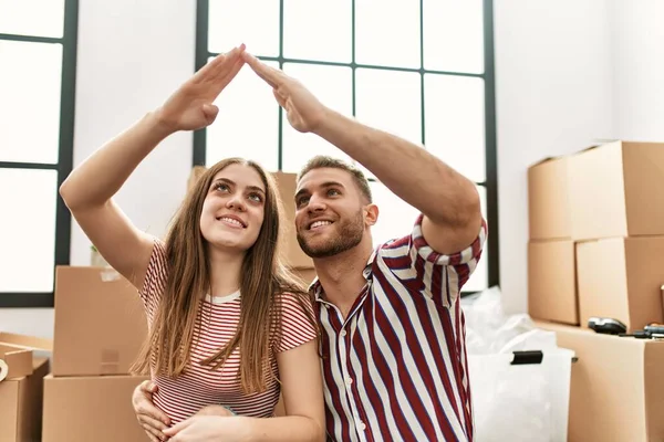 Young Caucasian Couple Doing House Symbol Arms Raised New Home — Stock Photo, Image