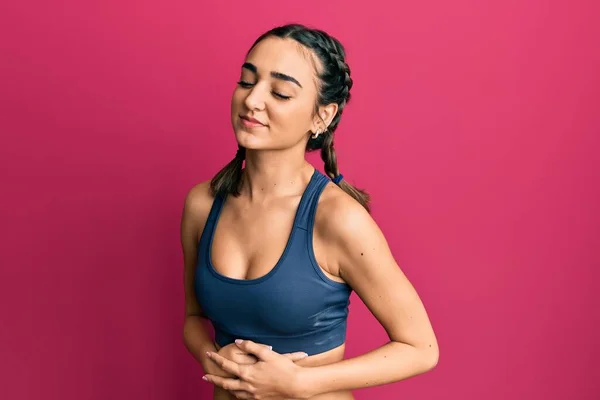 Young Brunette Girl Wearing Sportswear Braids Hand Stomach Because Nausea — Stockfoto