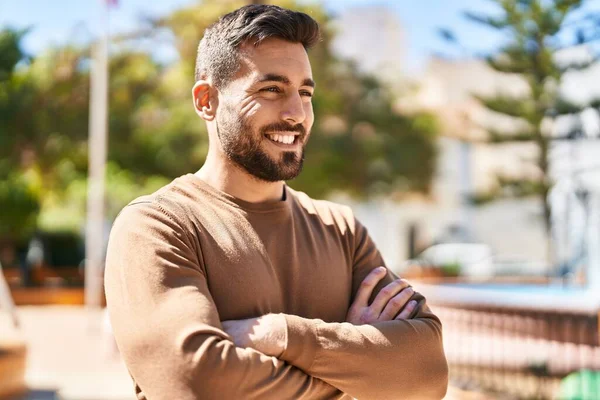 Young Hispanic Man Smiling Confident Standing Arms Crossed Gesture Park —  Fotos de Stock