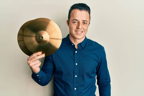 Handsome Young Man Holding Golden Cymbal Plates Looking Positive Happy — Stockfoto