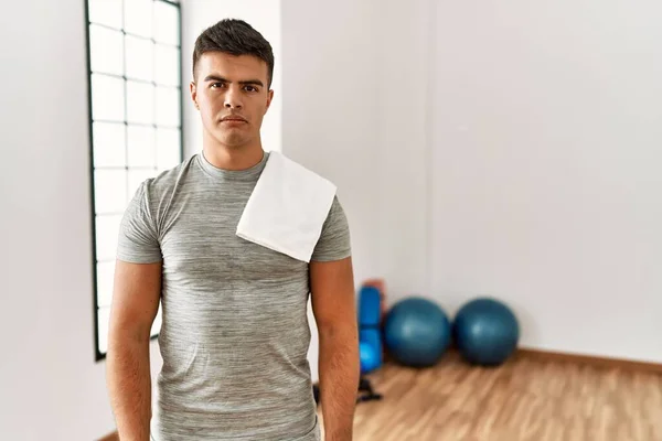 Young Hispanic Man Wearing Sportswear Towel Gym Skeptic Nervous Frowning — Stok fotoğraf