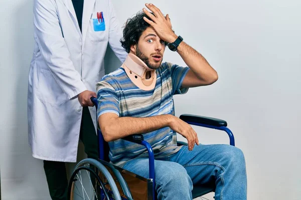 Handsome Hispanic Man Sitting Wheelchair Wearing Neck Collar Surprised Hand — kuvapankkivalokuva