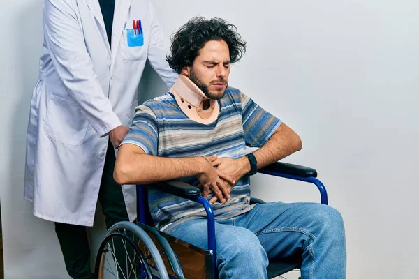 Handsome Hispanic Man Sitting Wheelchair Wearing Neck Collar Hand Stomach — Zdjęcie stockowe