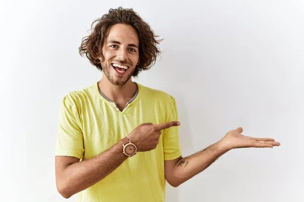 Young Hispanic Man Standing Isolated Background Amazed Smiling Camera While — Stok fotoğraf