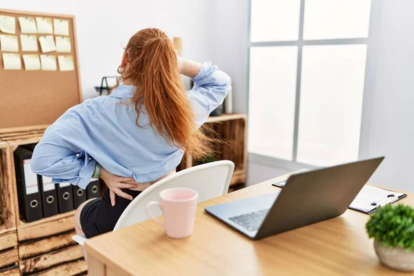 Young Redhead Woman Working Office Using Computer Laptop Backwards Thinking — стоковое фото