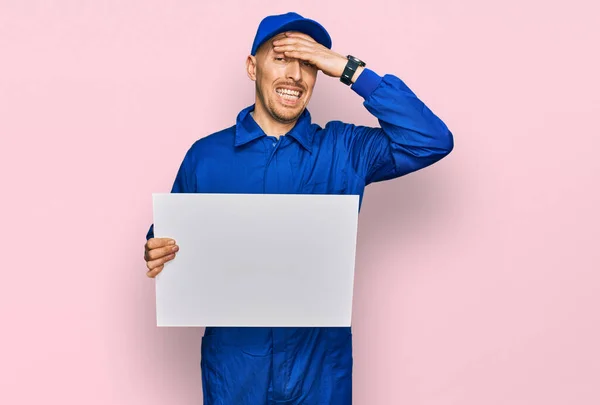 Bald Man Beard Wearing Builder Jumpsuit Uniform Holding Empty Banner — Stockfoto