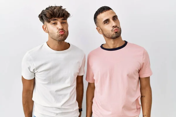 Young Gay Couple Standing Isolated Background Looking Camera Blowing Kiss — Stock Fotó