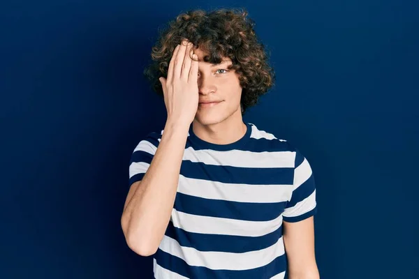 Handsome Young Man Wearing Casual Striped Shirt Covering One Eye — Foto Stock