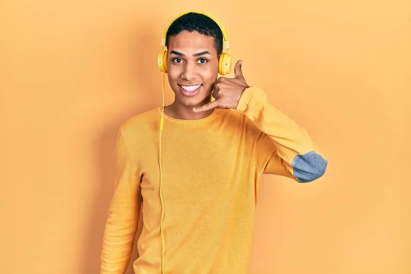 Young African American Guy Listening Music Using Headphones Smiling Doing —  Fotos de Stock