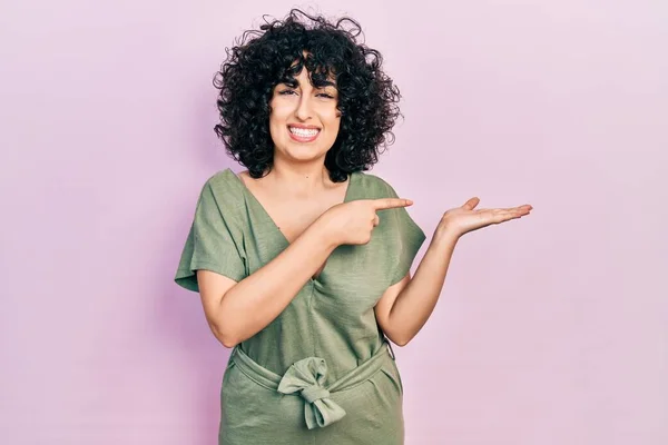 Young Middle East Woman Wearing Casual Clothes Amazed Smiling Camera — стоковое фото