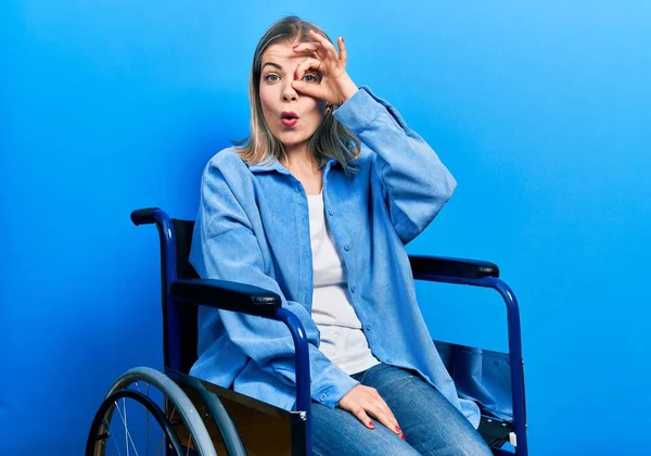 Beautiful Caucasian Woman Sitting Wheelchair Doing Gesture Shocked Surprised Face — стоковое фото