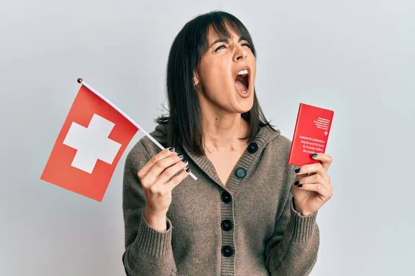 Young Hispanic Woman Holding Swiss Flag Passport Angry Mad Screaming — ストック写真
