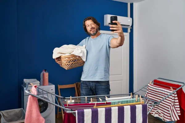 Handsome Middle Age Man Holding Laundry Basket Doing Selfie Picture — Stock Photo, Image