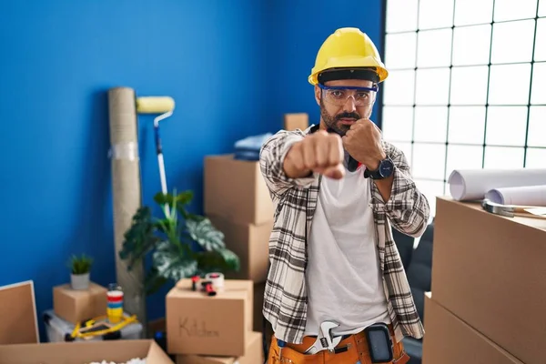 Young Hispanic Man Beard Working Home Renovation Punching Fist Fight — стоковое фото