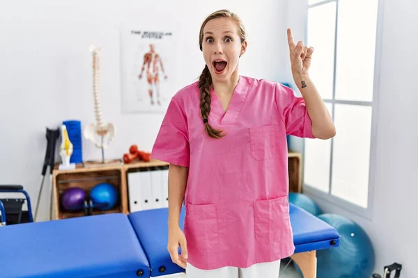 Young Blonde Woman Working Pain Recovery Clinic Pointing Finger Successful — ストック写真