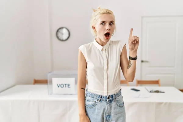 Beautiful Caucasian Woman Standing Voting Ballot Election Room Pointing Finger — Foto Stock