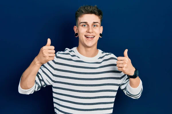 Young Caucasian Boy Ears Dilation Wearing Casual Striped Shirt Success — Foto Stock