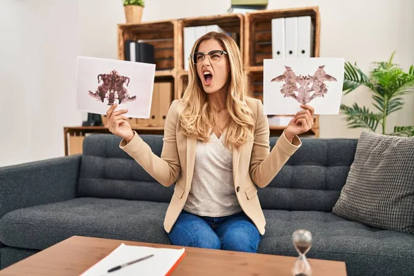 Young Blonde Therapist Woman Holding Rorschach Test Angry Mad Screaming — Photo