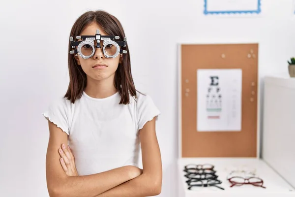 Young Hispanic Girl Wearing Optometry Glasses Skeptic Nervous Disapproving Expression — стоковое фото