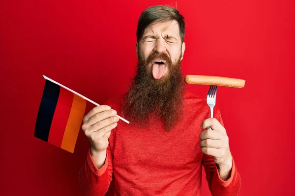 Redhead Man Long Beard Holding Fork Pork Sausage Germany Flag — стоковое фото