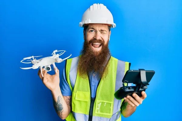 Redhead Man Long Beard Wearing Safety Hard Using Drone Remote — Fotografia de Stock