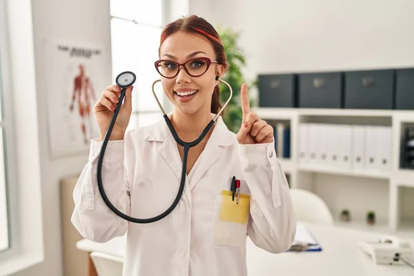 Young Caucasian Woman Wearing Doctor Uniform Using Stethoscope Surprised Idea — Stock Photo, Image