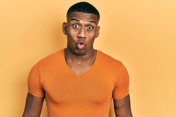 Young Black Man Wearing Casual Orange Shirt Scared Amazed Open — Photo