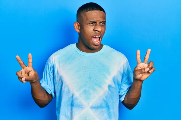 Young Black Man Doing Victory Sign Peace Gesture Angry Mad — Stock Photo, Image