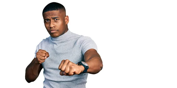 Young Black Man Wearing Casual Shirt Punching Fist Fight Aggressive — Fotografia de Stock