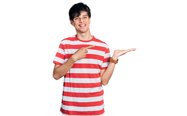 Handsome Hipster Young Man Wearing Casual Striped Shirt Amazed Smiling Stock Picture