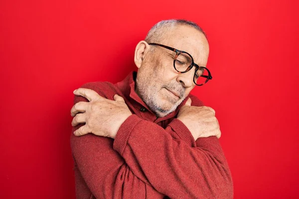 Handsome Mature Man Wearing Casual Sweater Glasses Hugging Oneself Happy — Stockfoto