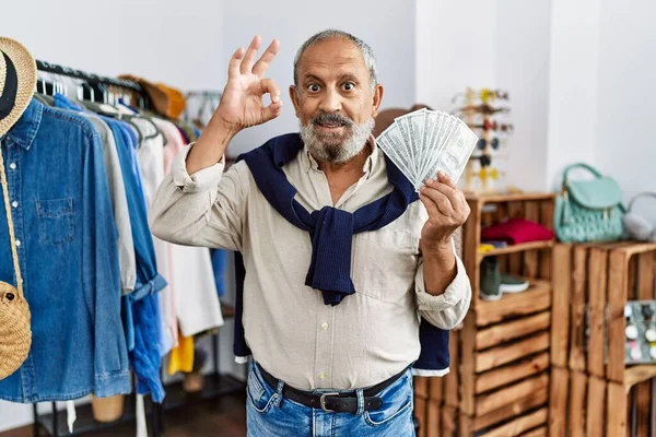 Handsome Senior Man Retail Shop Holding Dollars Banknotes Doing Sign — Stockfoto