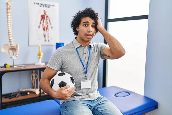 Hispanic Man Curly Hair Working Football Physiotherapist Crazy Scared Hands — Stok fotoğraf