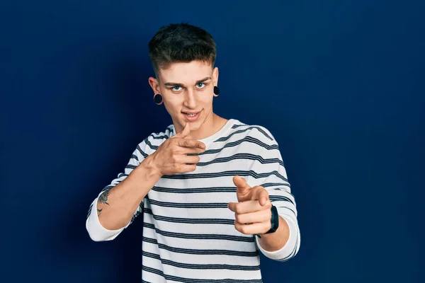 Young Caucasian Boy Ears Dilation Wearing Casual Striped Shirt Pointing — Stok Foto