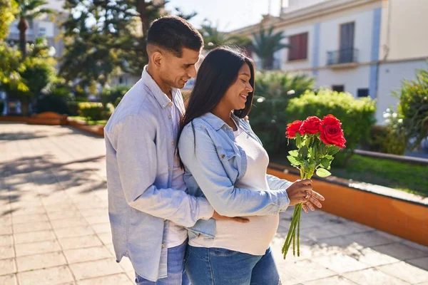 Young Latin Couple Expecting Baby Surprise Flowers Park — Photo