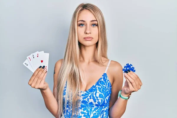 Young Beautiful Caucasian Woman Holding Poker Cards Chips Relaxed Serious — Stok fotoğraf