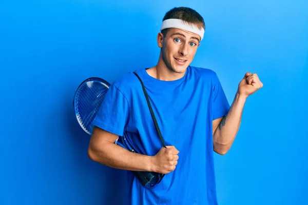 Young Caucasian Man Holding Tennis Bag Screaming Proud Celebrating Victory — Stockfoto