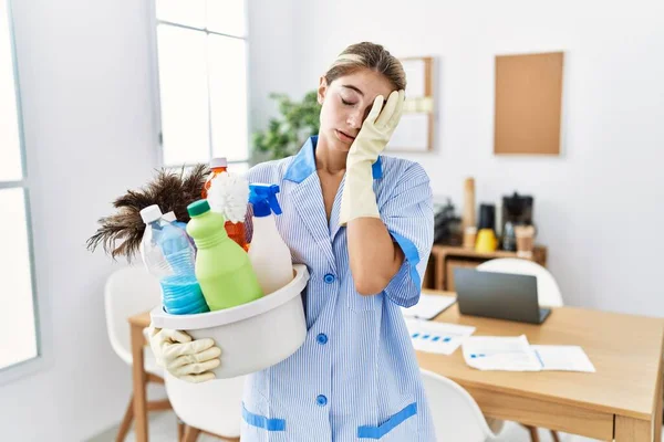 Young Blonde Woman Wearing Cleaner Uniform Holding Cleaning Products Yawning — Fotografia de Stock