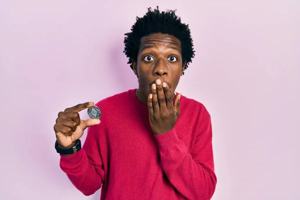 Young African American Man Holding Virtual Currency Ethereum Coin Covering — Stockfoto