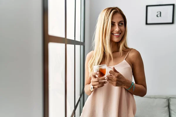 Young Caucasian Girl Smiling Happy Drinking Cup Tea Standing Home — Fotografia de Stock