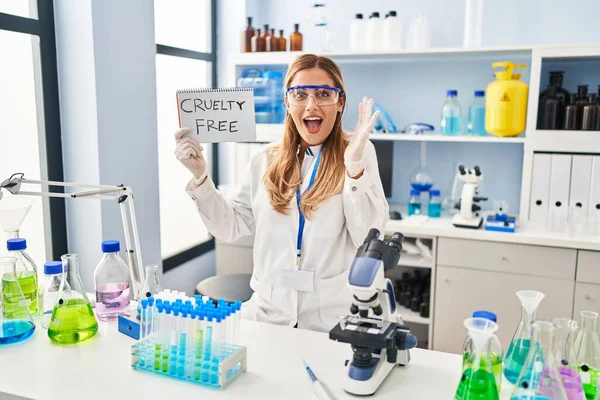 Young Blonde Scientist Woman Working Cruelty Free Laboratory Celebrating Victory — Fotografia de Stock